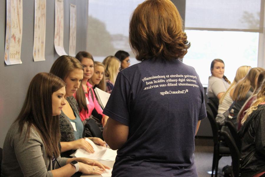 Students listening in a classroom at a New Student Orientation event